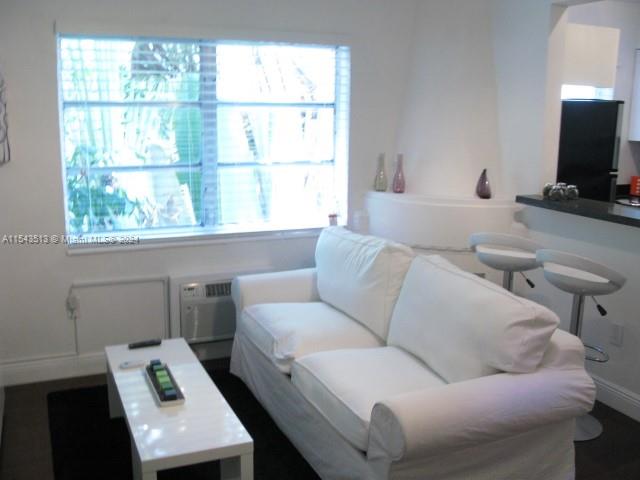 1525 Meridian Avenue, Unit 207 Miami Beach, FL 33139 - Photo 13 of 18 a living room with furniture and a flat screen tv