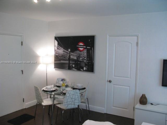 1525 Meridian Avenue, Unit 207 Miami Beach, FL 33139 - Photo 15 of 18 a living room with furniture a rug and a flat screen tv