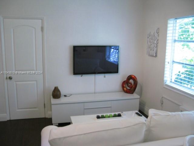 1525 Meridian Avenue, Unit 207 Miami Beach, FL 33139 - Photo 4 of 18 a living room with furniture and a flat screen tv