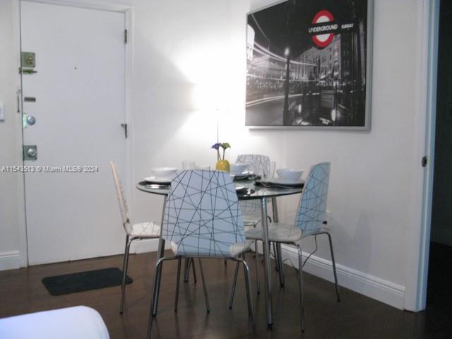 1525 Meridian Avenue, Unit 207 Miami Beach, FL 33139 - Photo 7 of 18 a view of a dining room with furniture and wooden floor