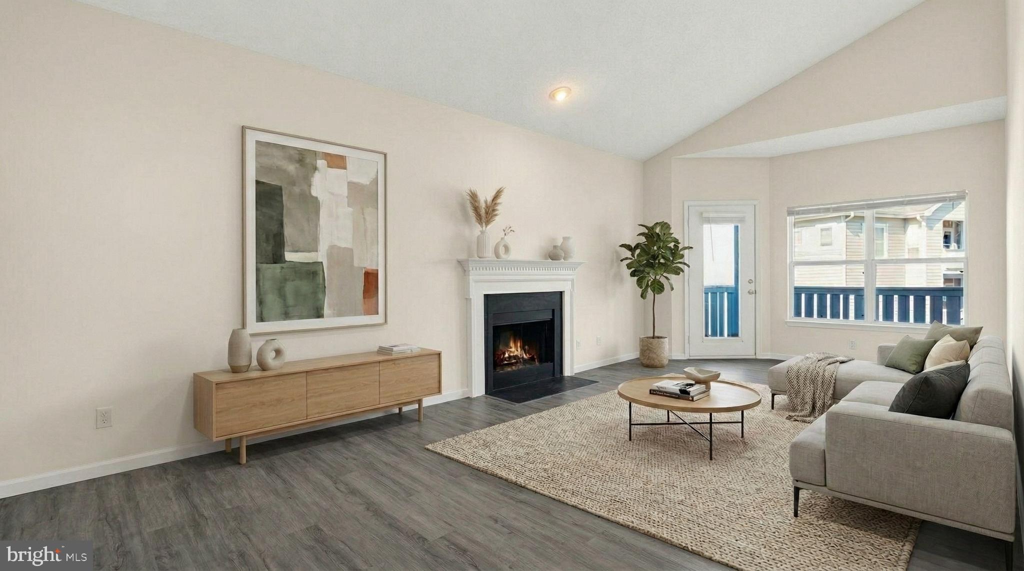 14322 Climbing Rose Way, Unit 306 Centreville, VA 20121 - Photo 1 of 35 a living room with furniture and a fireplace