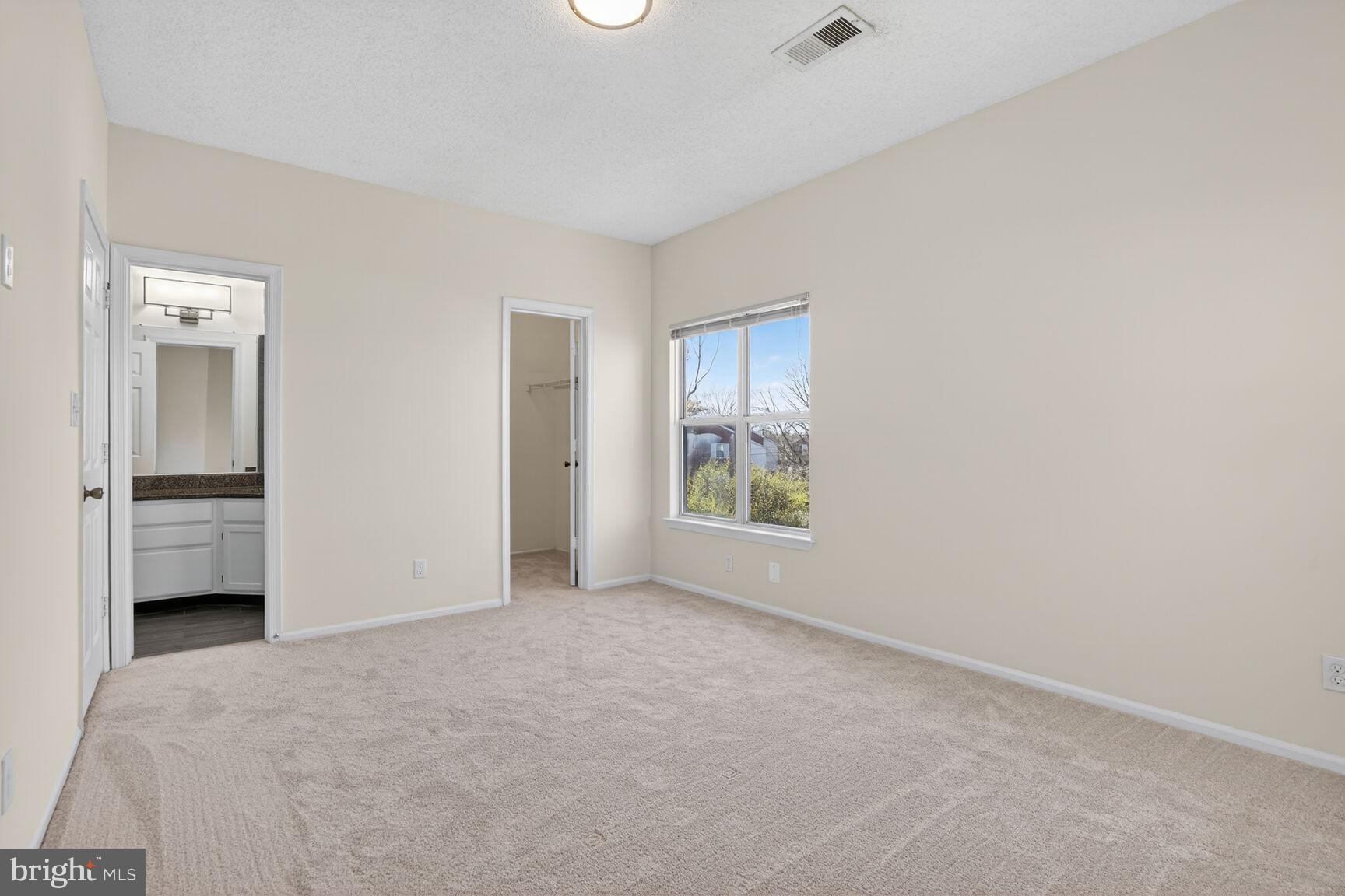 14322 Climbing Rose Way, Unit 306 Centreville, VA 20121 - Photo 12 of 35 a view of an empty room with a window