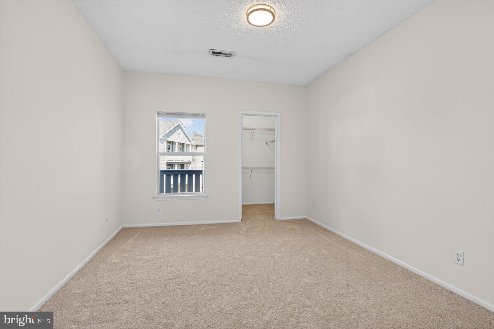14322 Climbing Rose Way, Unit 306 Centreville, VA 20121 - Photo 18 of 35 an empty room with windows