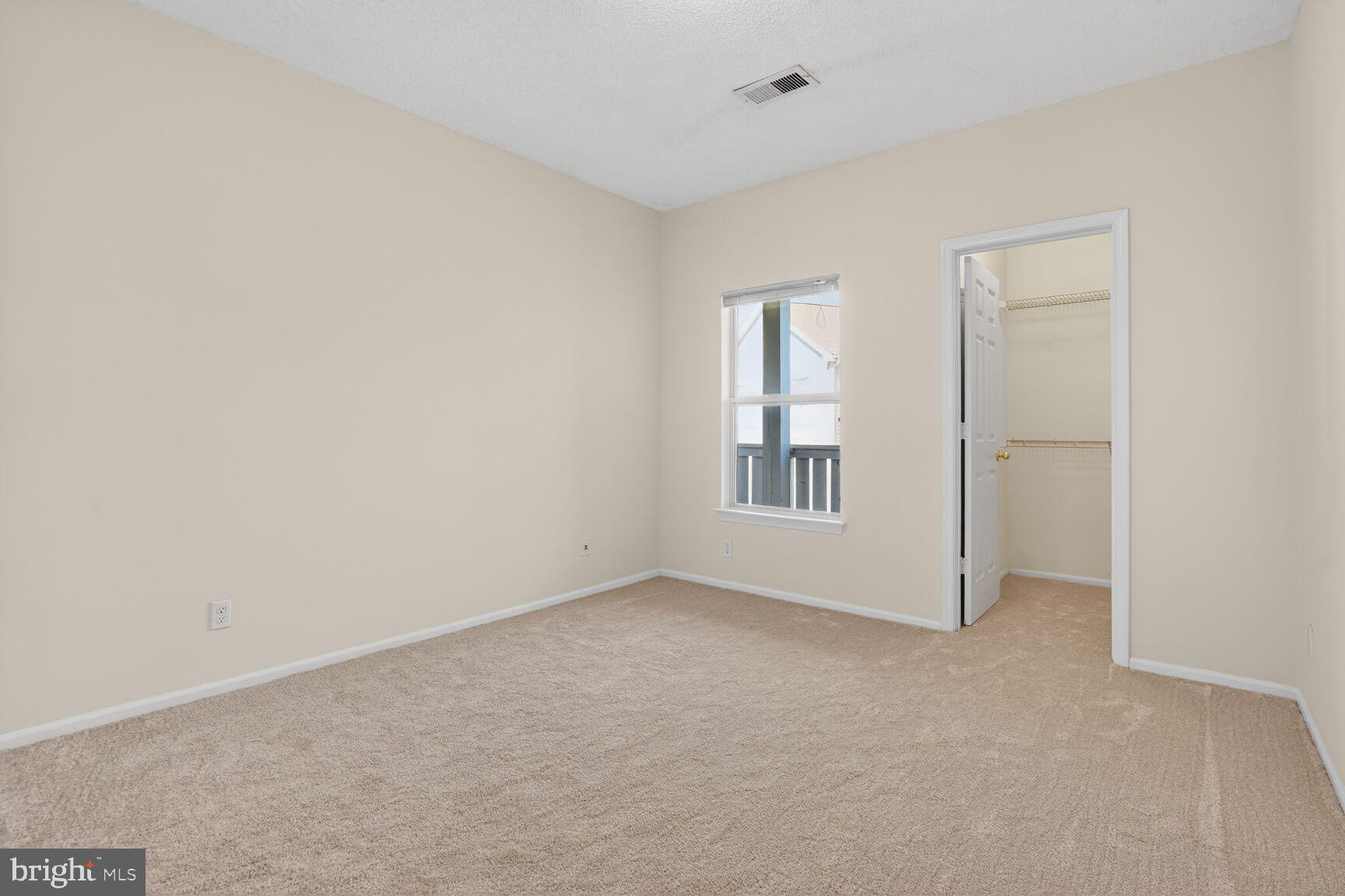 14322 Climbing Rose Way, Unit 306 Centreville, VA 20121 - Photo 19 of 35 an empty room with windows
