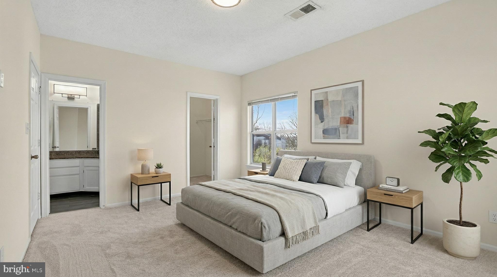 14322 Climbing Rose Way, Unit 306 Centreville, VA 20121 - Photo 2 of 35 a bedroom with a bed and a potted plant