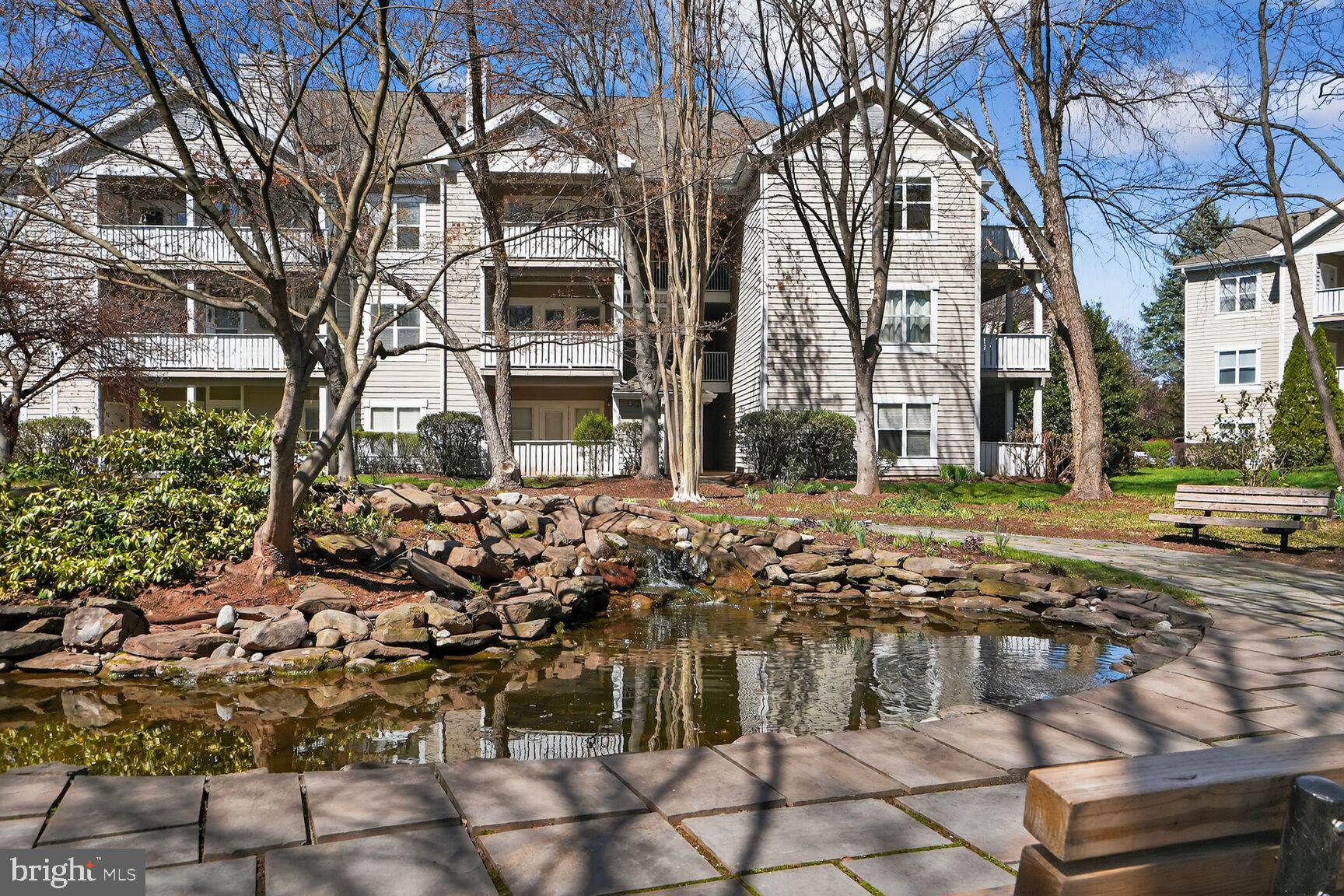 14322 Climbing Rose Way, Unit 306 Centreville, VA 20121 - Photo 26 of 35 a view of a large building