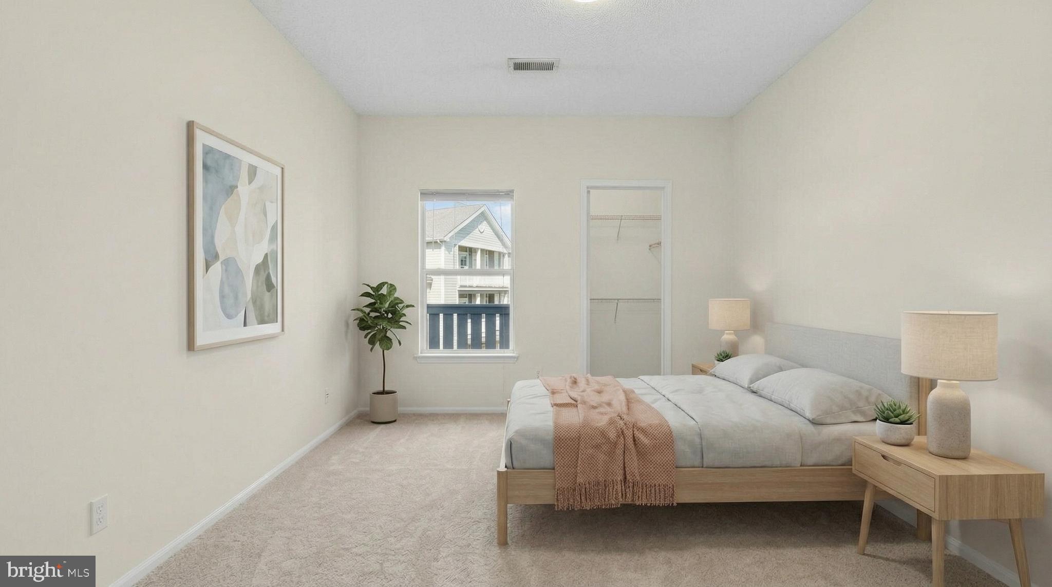 14322 Climbing Rose Way, Unit 306 Centreville, VA 20121 - Photo 3 of 35 a bedroom with a bed and a window
