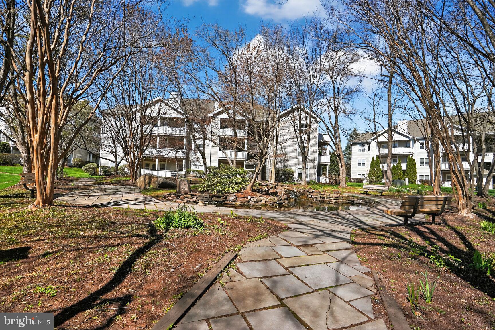 14322 Climbing Rose Way, Unit 306 Centreville, VA 20121 - Photo 35 of 35 a view of a yard with a house
