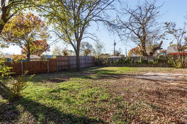 a view of backyard with green space