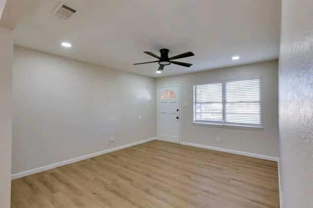 a view of an empty room with a window