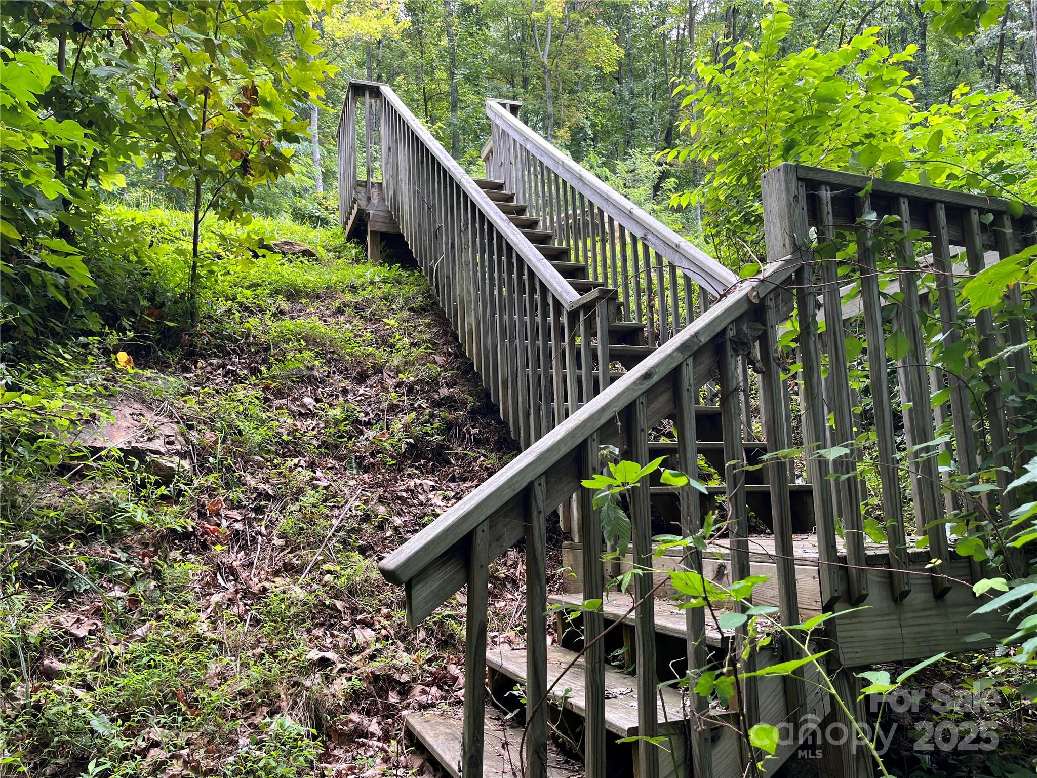 4 Summit View Drive, Unit 4 Candler, NC 28715 - Photo 12 of 23 a balcony with lots of green trees