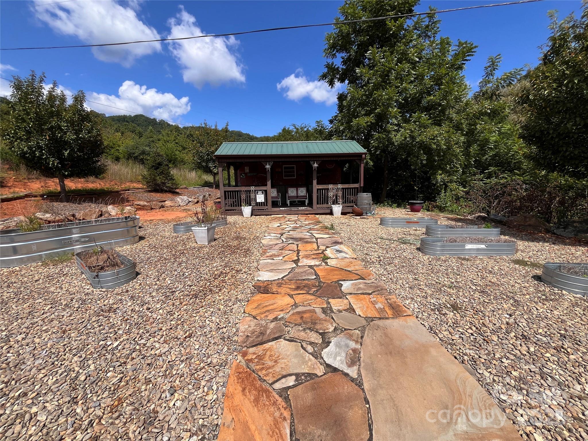 4 Summit View Drive, Unit 4 Candler, NC 28715 - Photo 19 of 23 a view of a yard with a patio