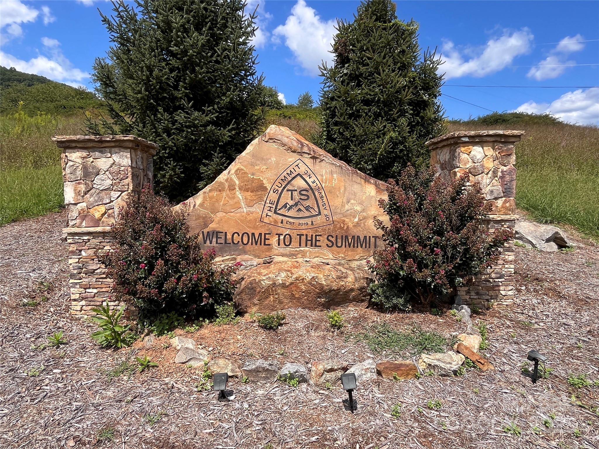 4 Summit View Drive, Unit 4 Candler, NC 28715 - Photo 4 of 23 a sign board with a yard