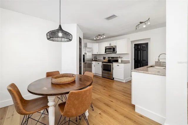 a workspace with furniture and painting on the wall