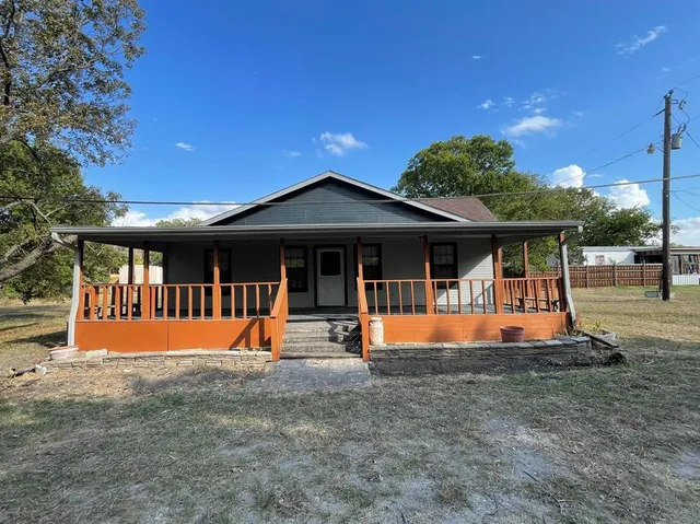 a view of pool with a chairs