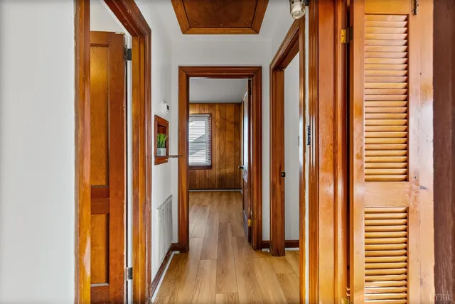 a view of closet with wooden floor