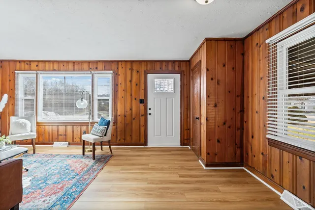 a view of a livingroom with wooden floor and a couch