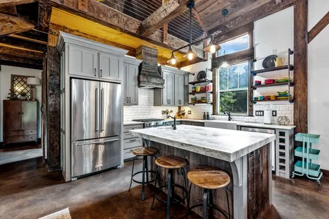 a kitchen that has a sink and a stove
