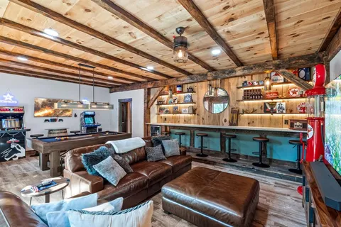 a bedroom with a bed next to a window