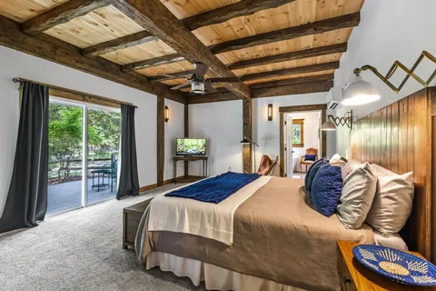 a roof deck with couch and chairs