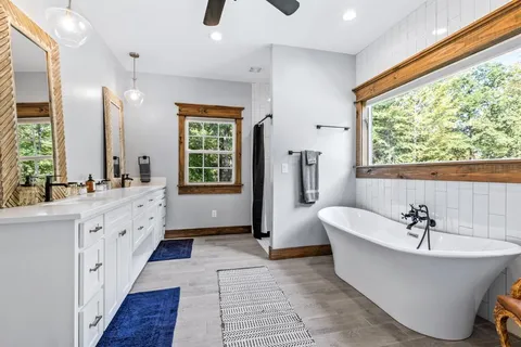 a bedroom with two beds and a window