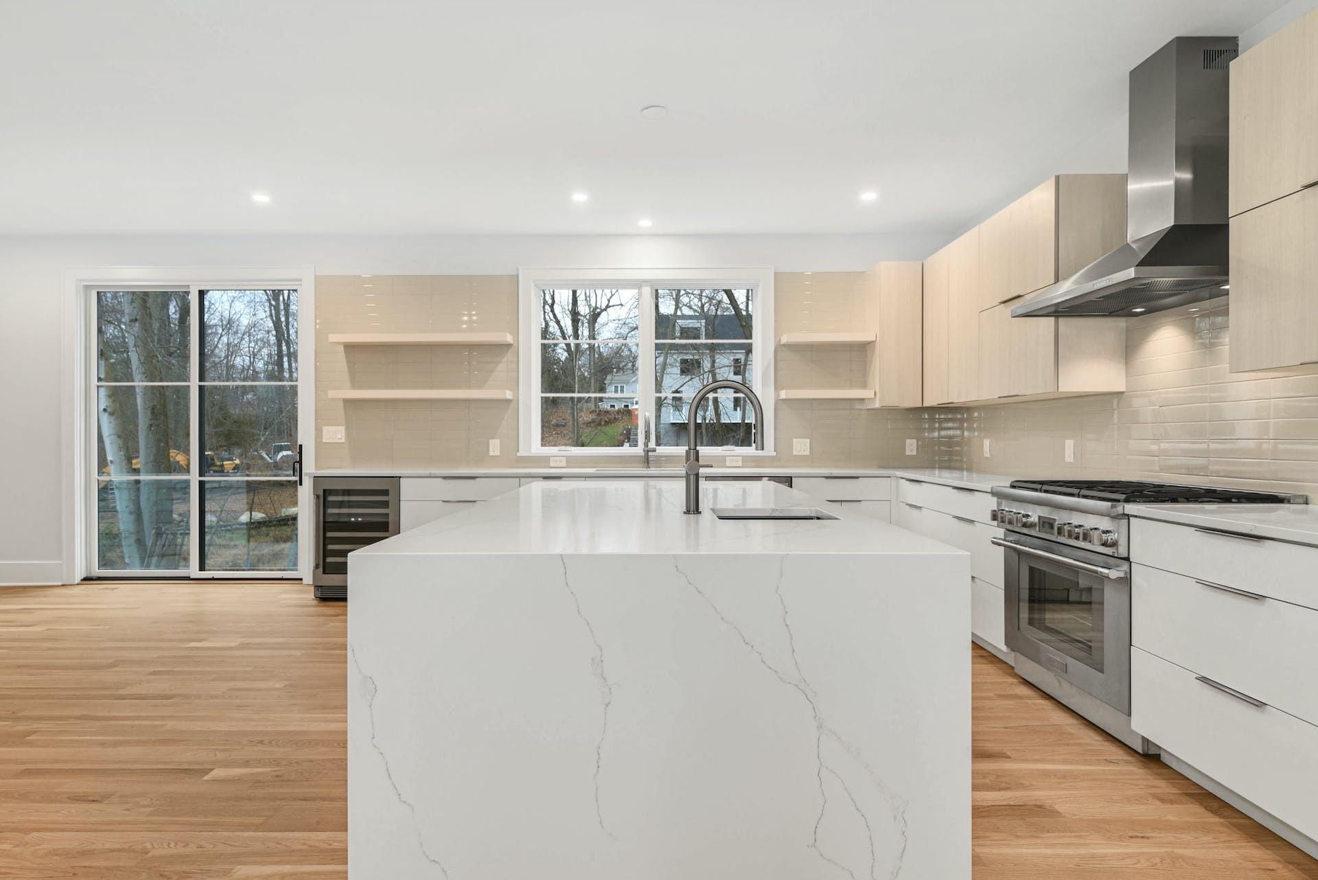77 Witch Lane Rowayton, CT 06853 - Photo 11 of 39 a kitchen with stainless steel appliances granite countertop a stove and a sink