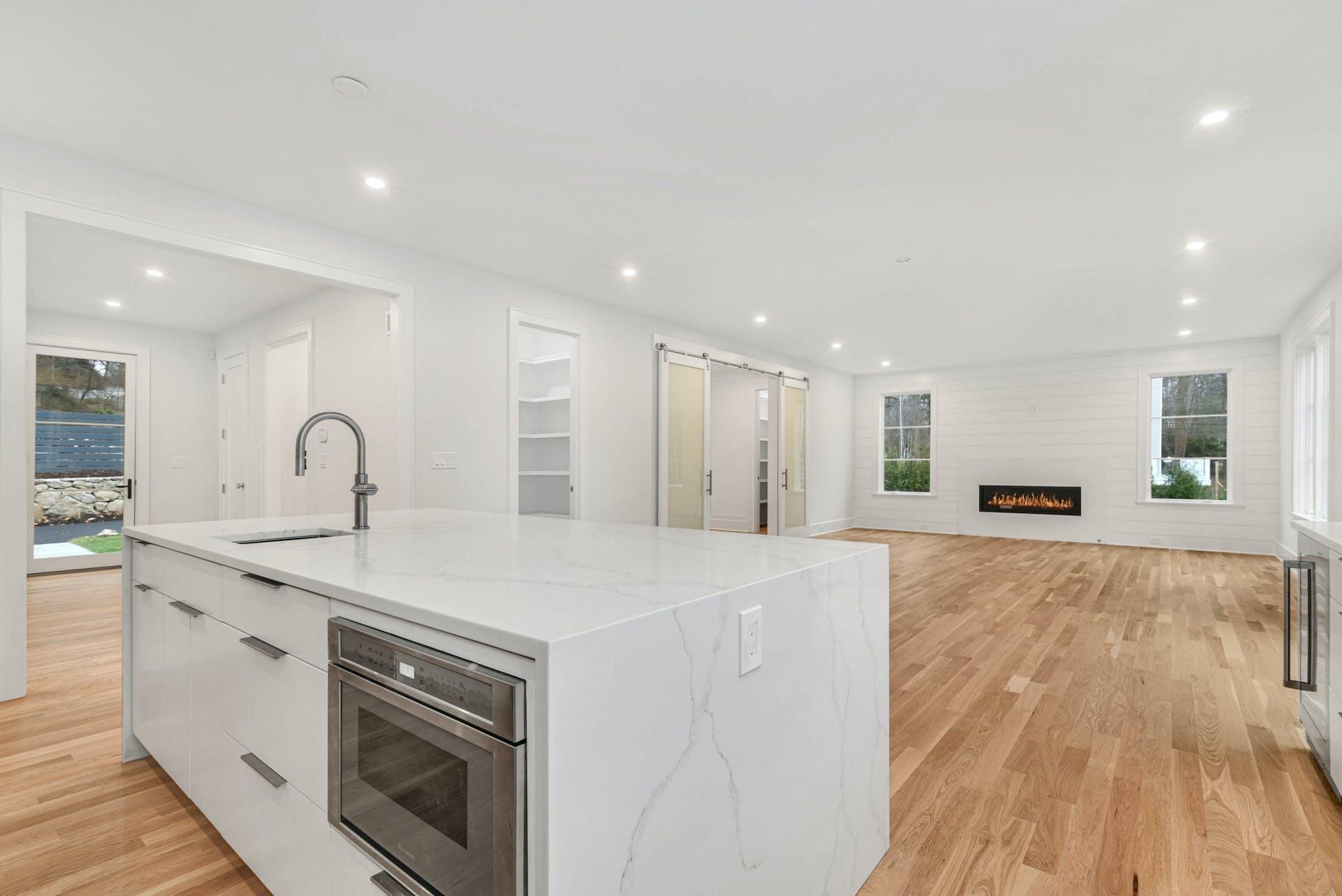 77 Witch Lane Rowayton, CT 06853 - Photo 14 of 39 a view of a kitchen with a sink and dishwasher with wooden floor