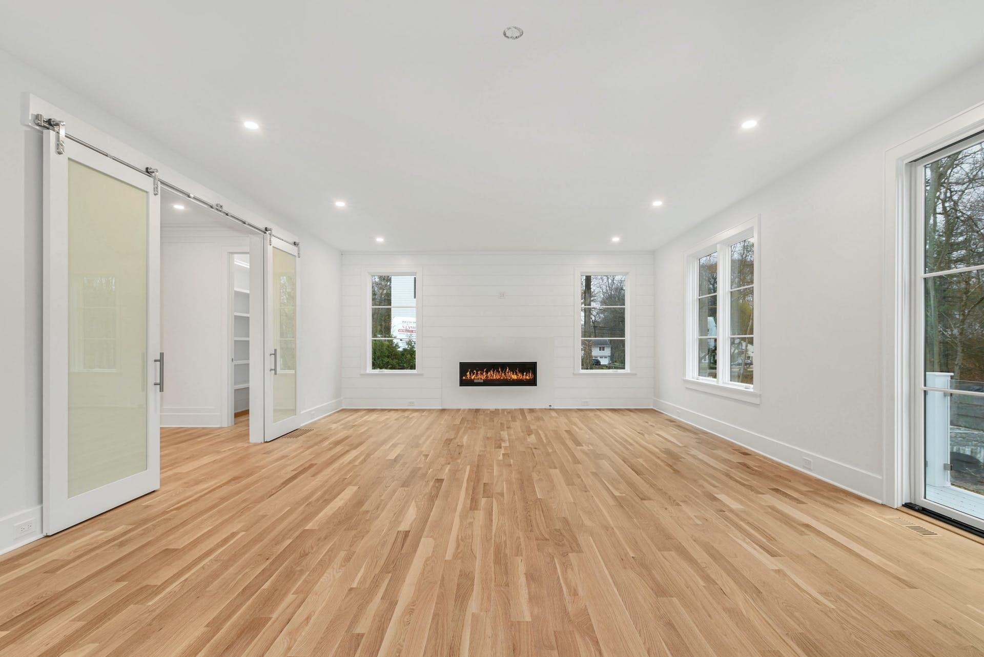 77 Witch Lane Rowayton, CT 06853 - Photo 15 of 39 a view of an empty room with wooden floor and a window