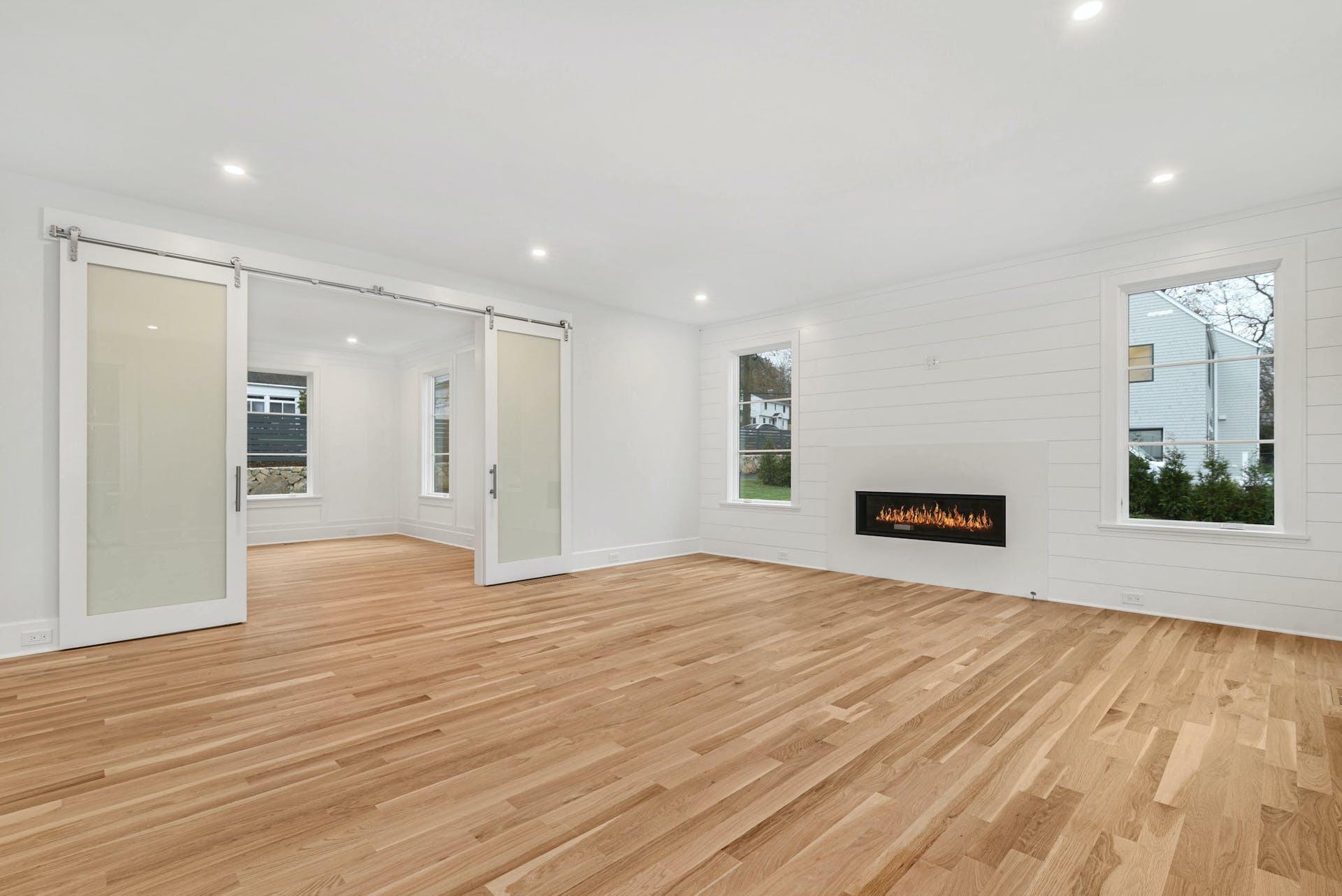 77 Witch Lane Rowayton, CT 06853 - Photo 16 of 39 a view of an empty room with wooden floor and a window