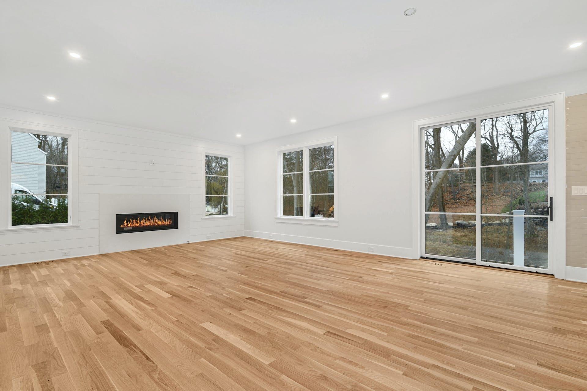 77 Witch Lane Rowayton, CT 06853 - Photo 17 of 39 a view of an empty room with wooden floor and a window