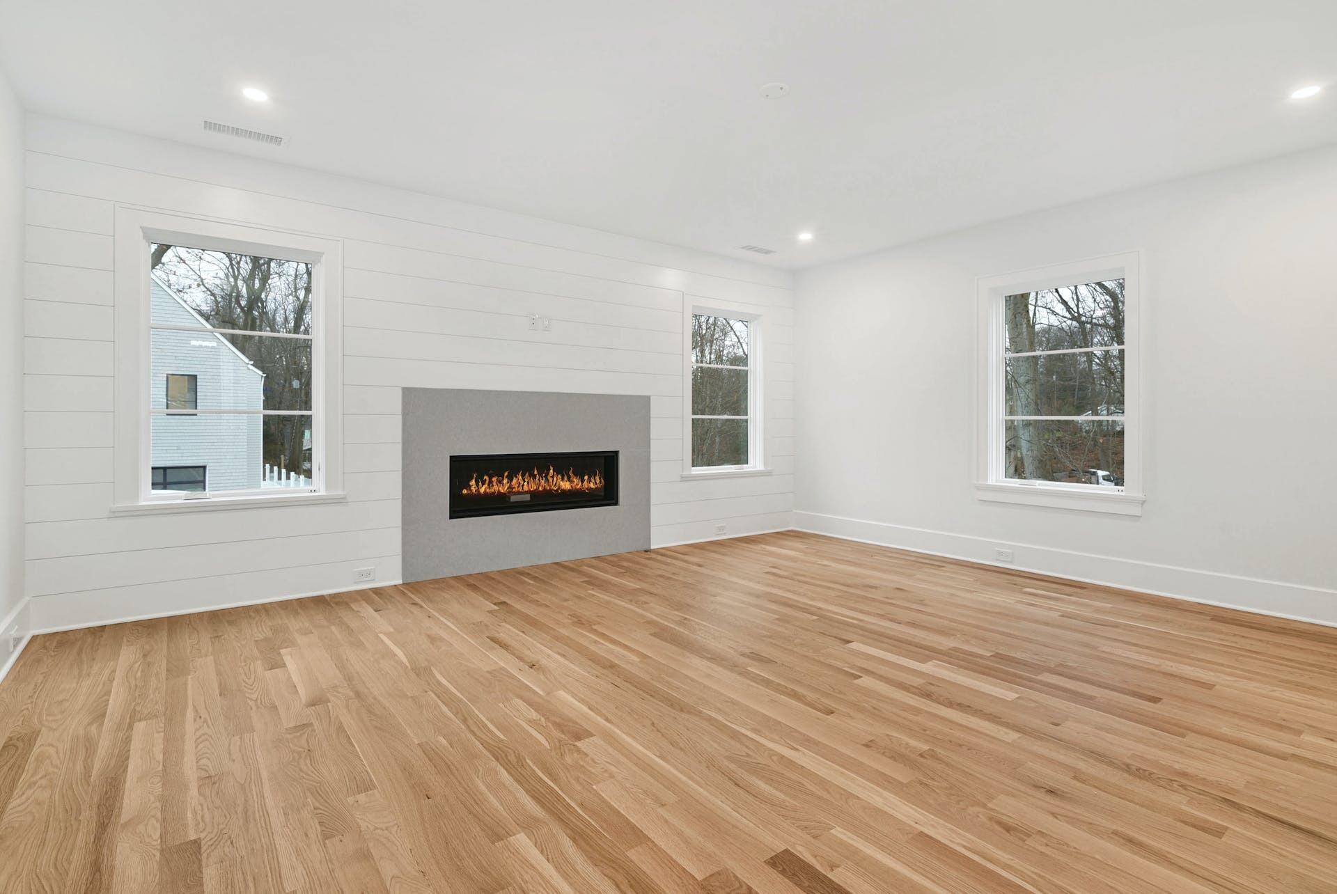 77 Witch Lane Rowayton, CT 06853 - Photo 20 of 39 a view of an empty room with a window and wooden floor