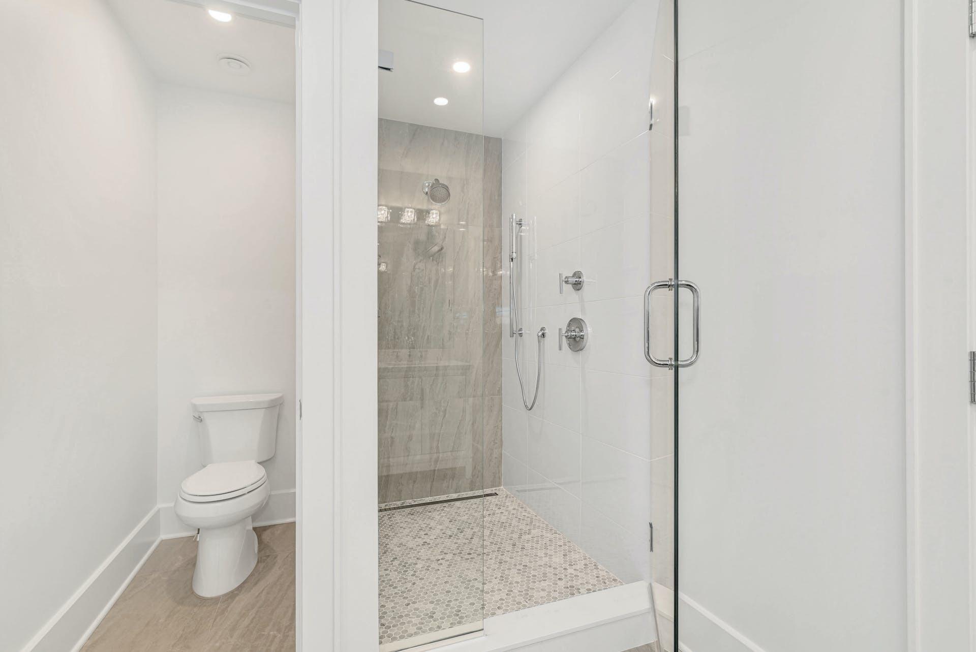77 Witch Lane Rowayton, CT 06853 - Photo 23 of 39 a bathroom with a shower and a toilet