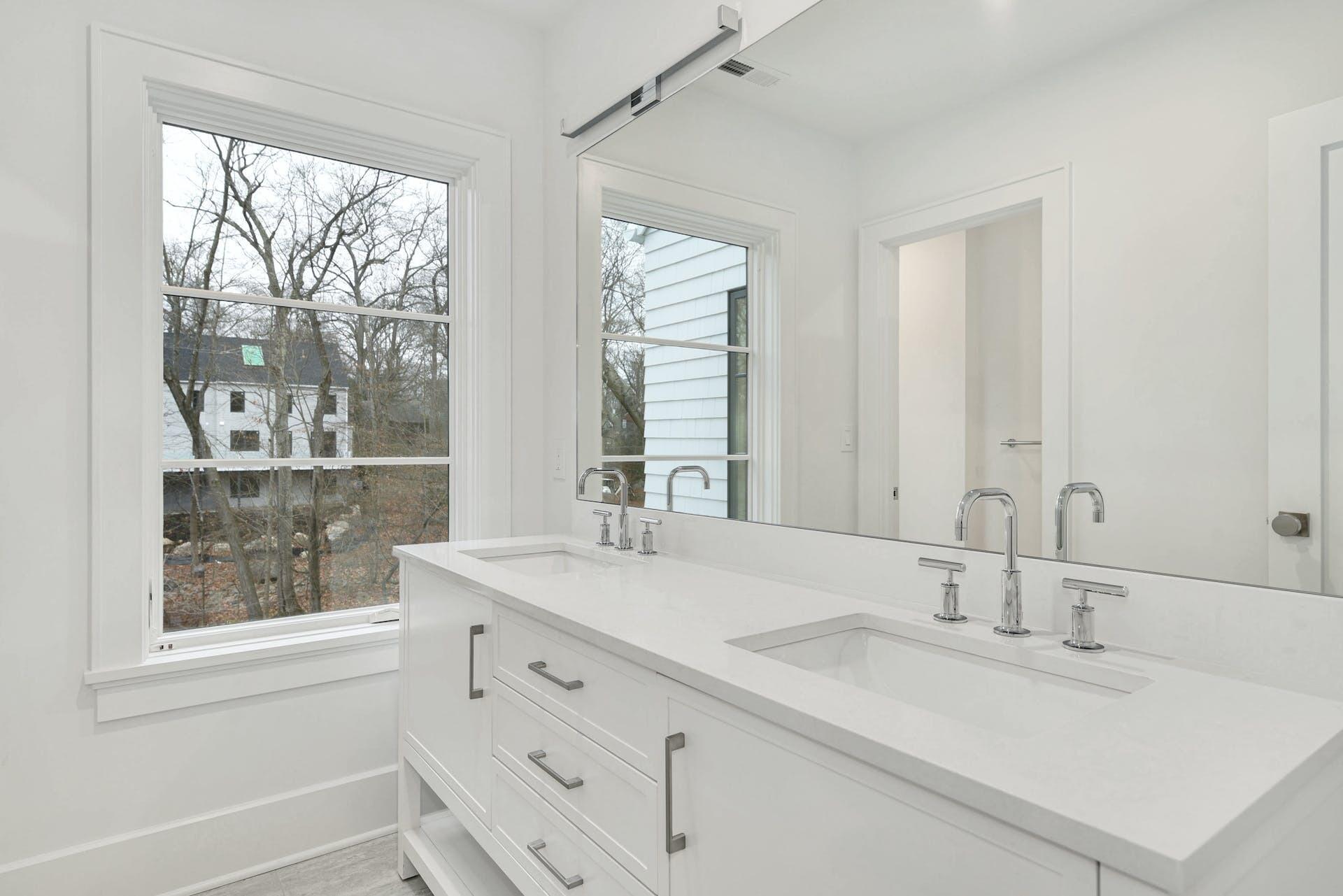 77 Witch Lane Rowayton, CT 06853 - Photo 24 of 39 a bathroom with a sink and a mirror