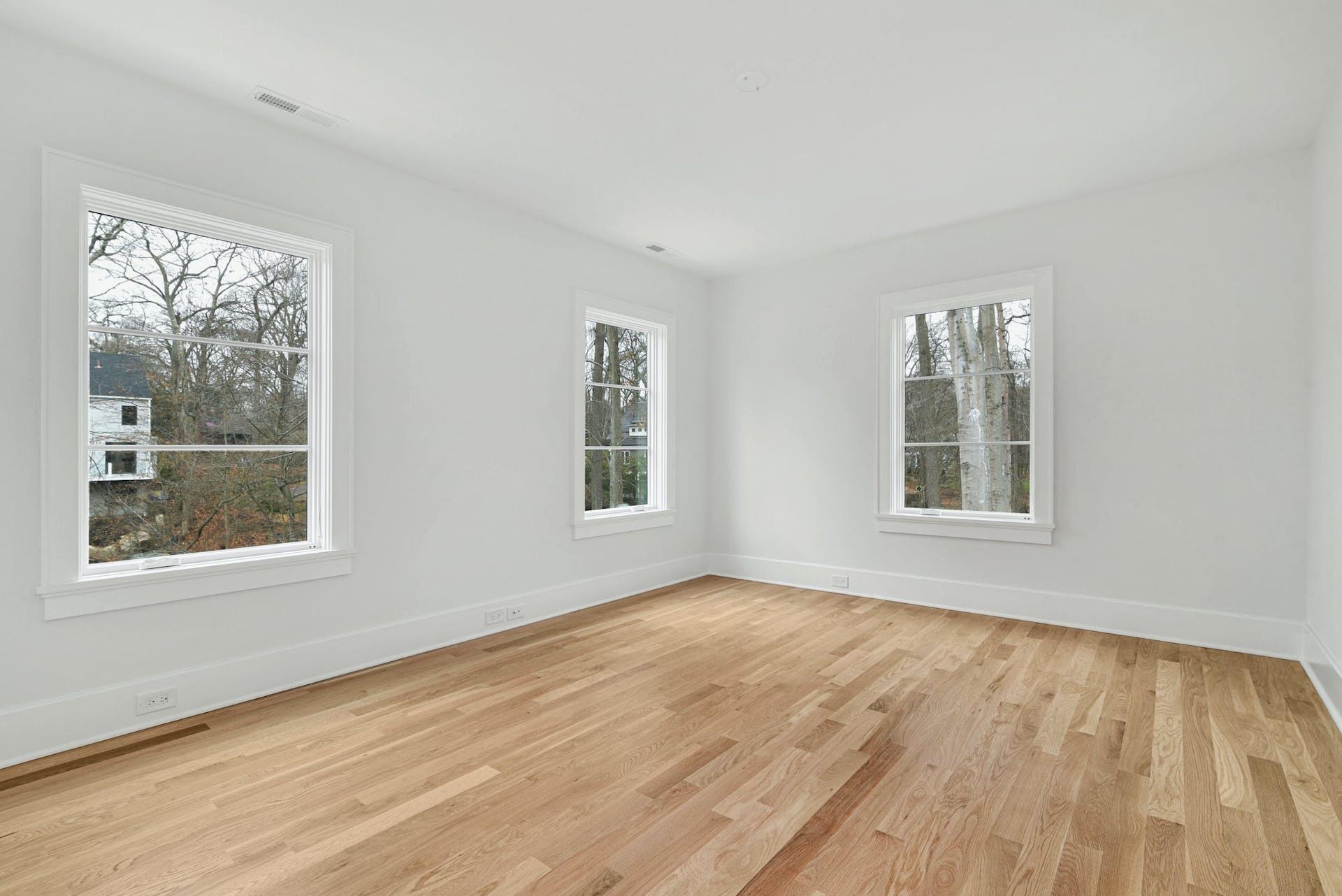 77 Witch Lane Rowayton, CT 06853 - Photo 25 of 39 a view of an empty room with wooden floor and a window