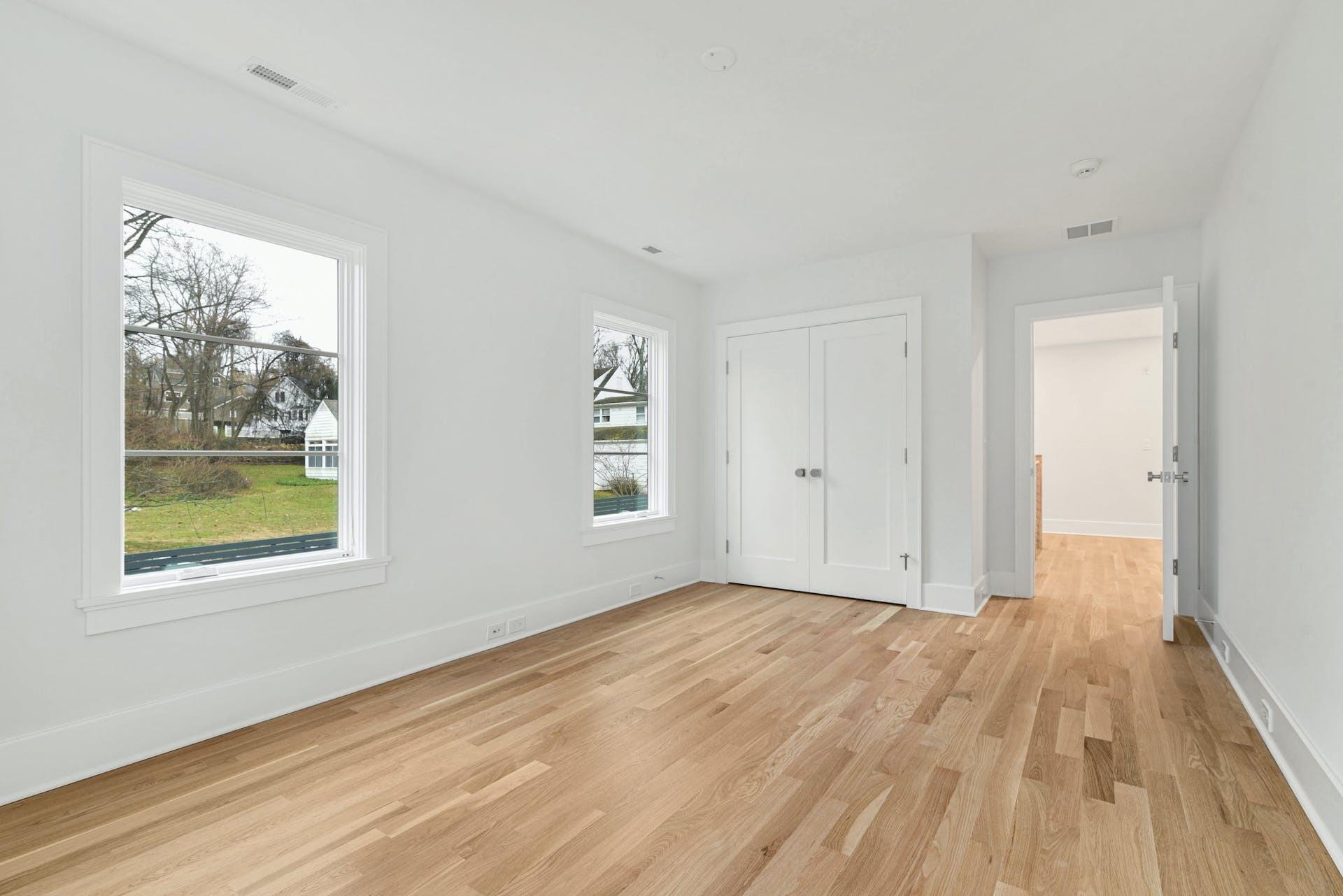 77 Witch Lane Rowayton, CT 06853 - Photo 26 of 39 a view of an empty room with wooden floor and a window