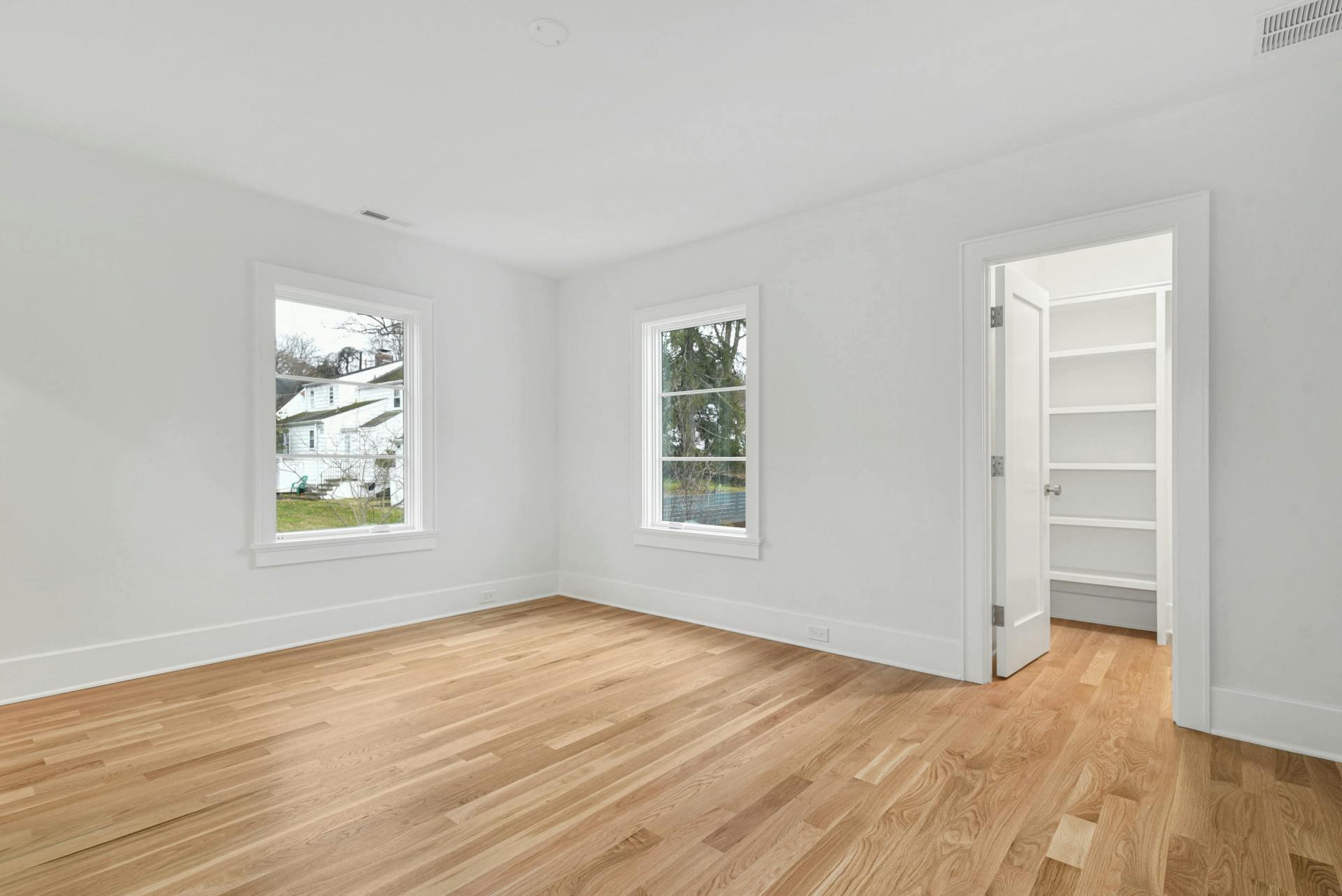 77 Witch Lane Rowayton, CT 06853 - Photo 27 of 39 a view of empty room with wooden floor and fan