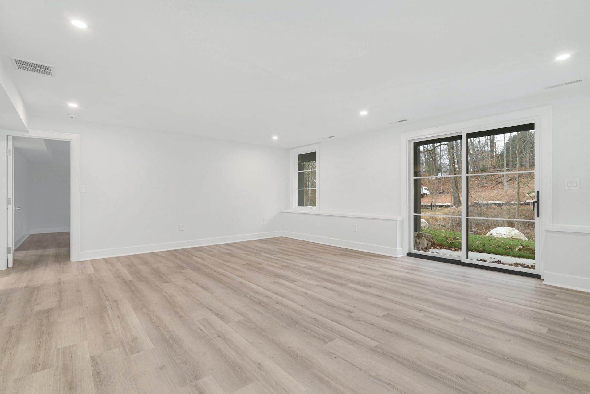 77 Witch Lane Rowayton, CT 06853 - Photo 30 of 39 a view of an empty room with wooden floor and a window