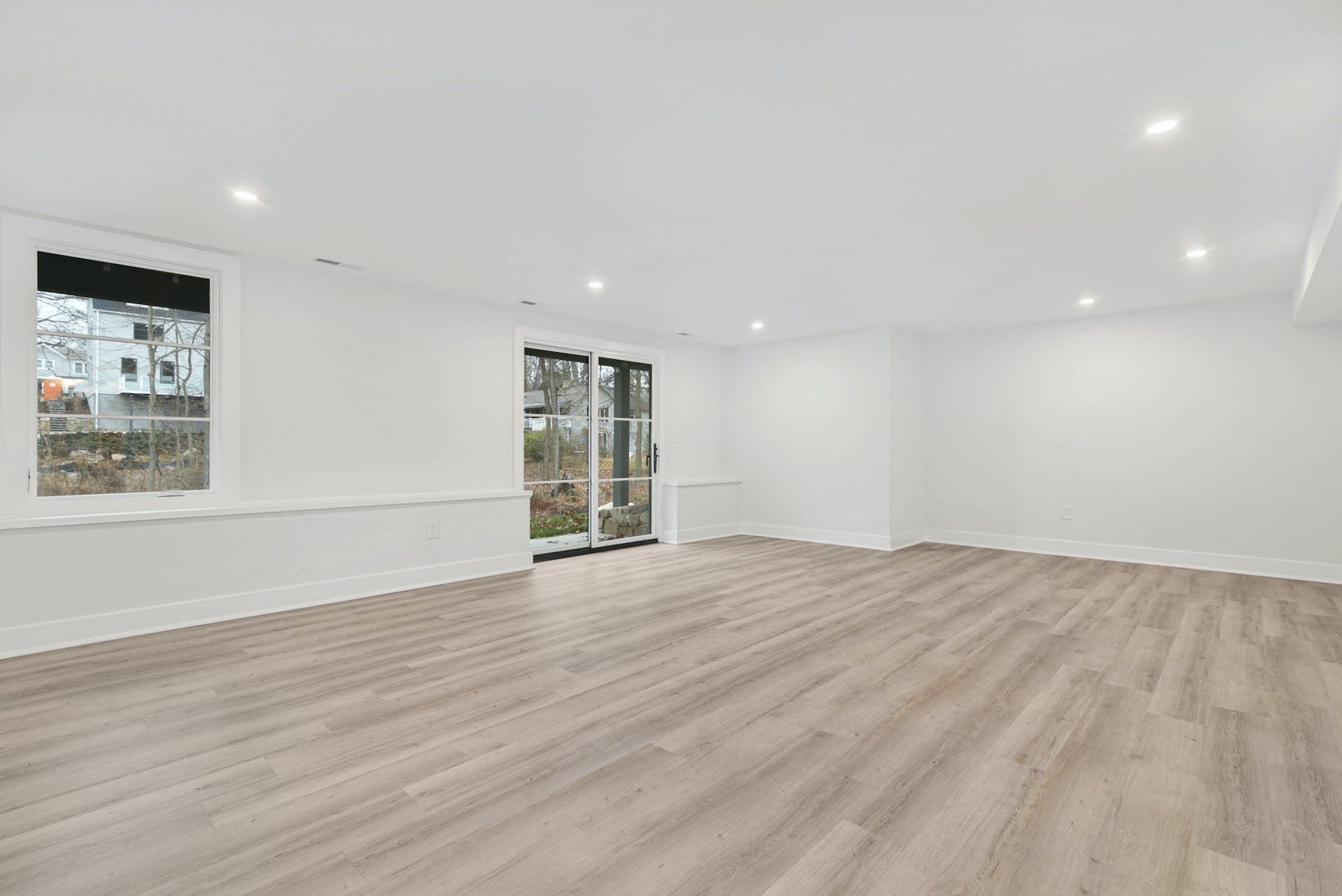 77 Witch Lane Rowayton, CT 06853 - Photo 31 of 39 a view of an empty room with wooden floor and a window