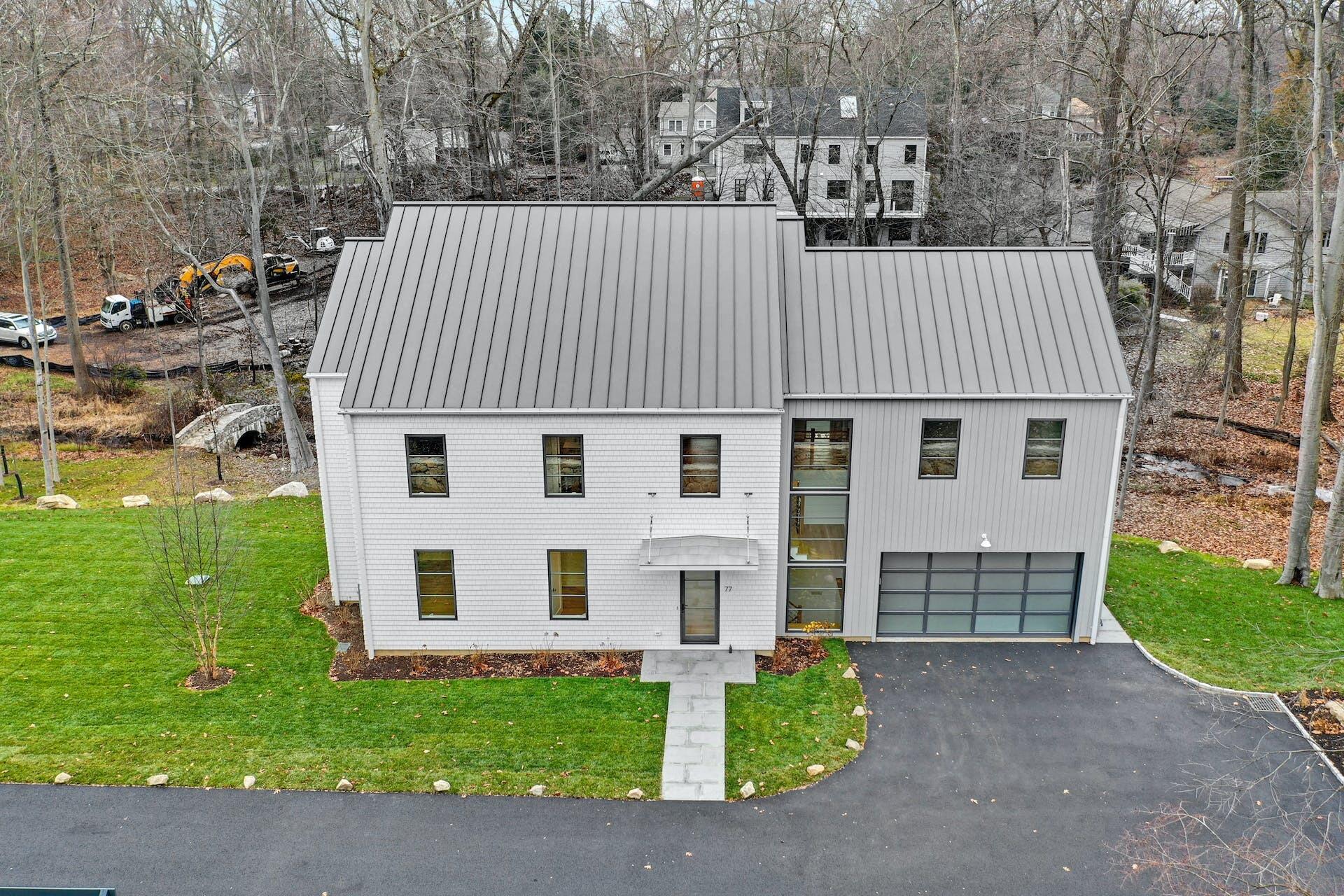 77 Witch Lane Rowayton, CT 06853 - Photo 36 of 39 a view of a house with a yard and sitting area