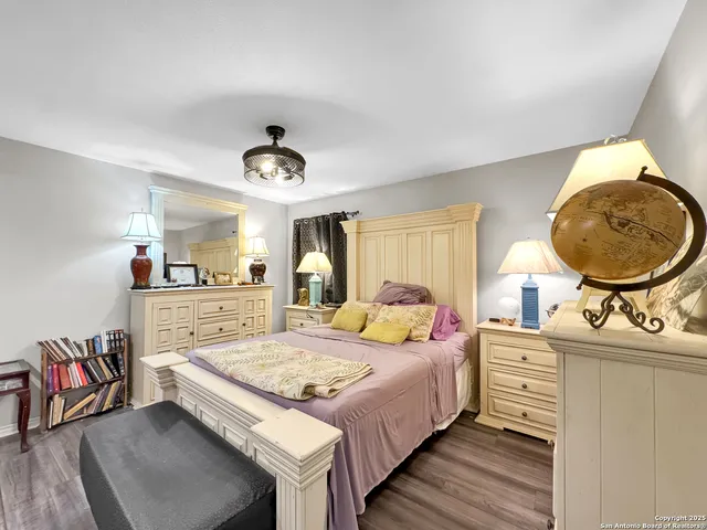 a bed room with a bed and a chandelier