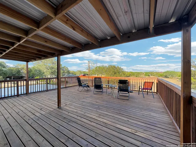 a view of a balcony with chairs