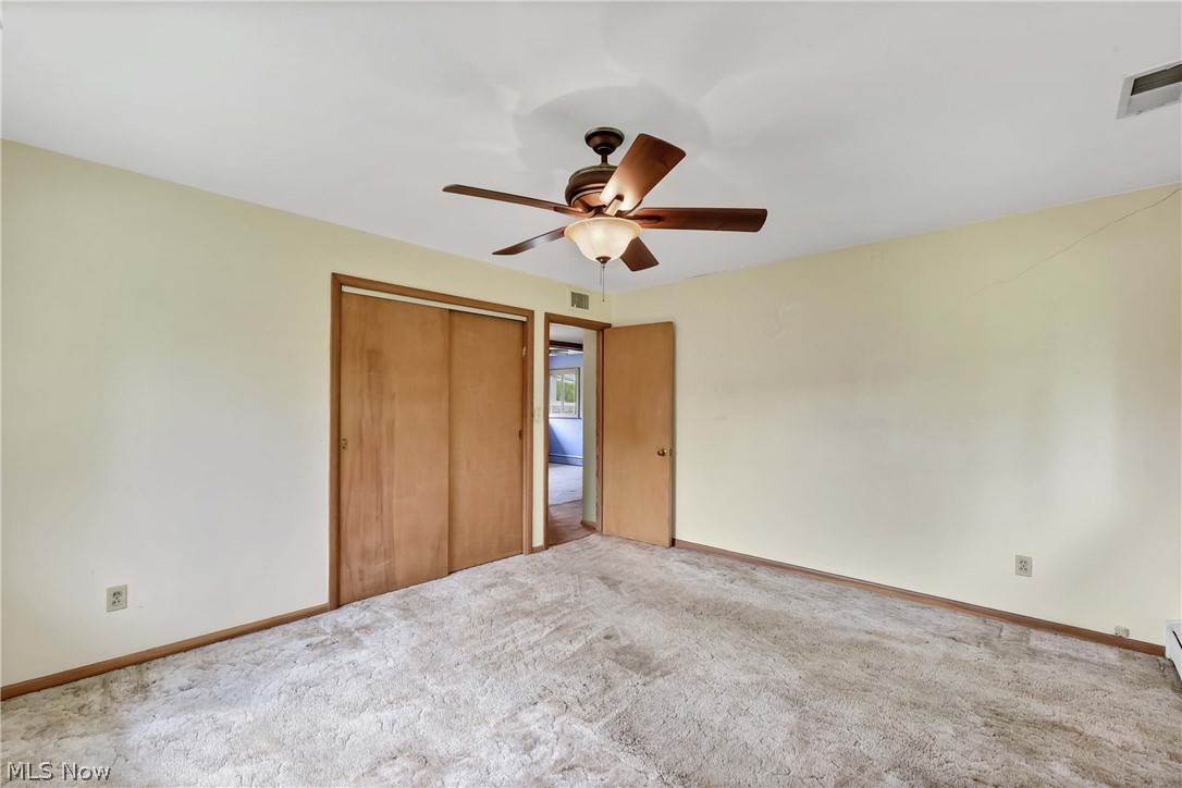 14593 Turney Road Maple Heights, OH 44137 - Photo 17 of 45 Unfurnished bedroom with carpet, ceiling fan, and a closet