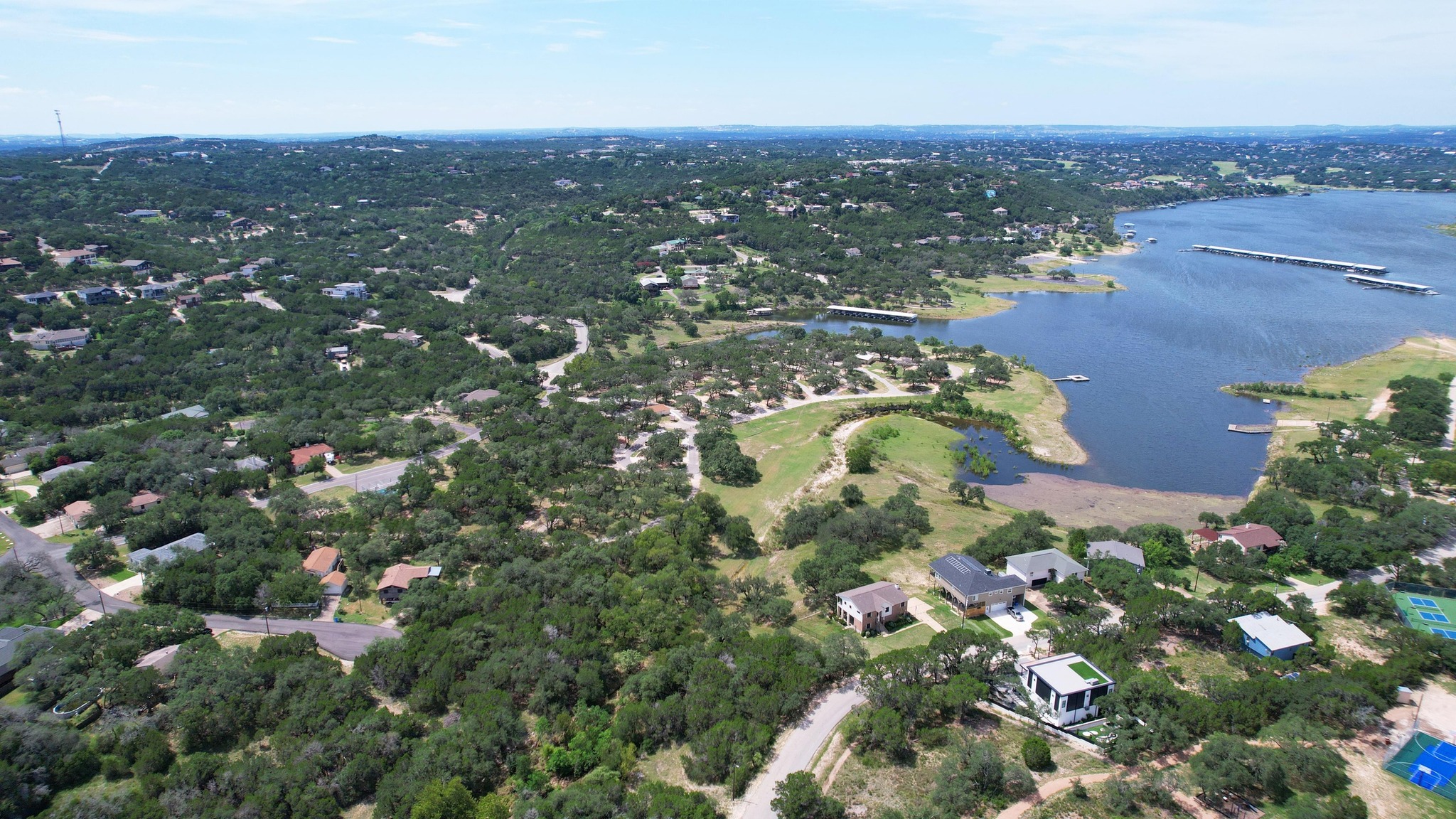 6719 Bar K Ranch Road Lago Vista, TX 78645 - Photo 19 of 36 an aerial view of residential houses with outdoor space and trees