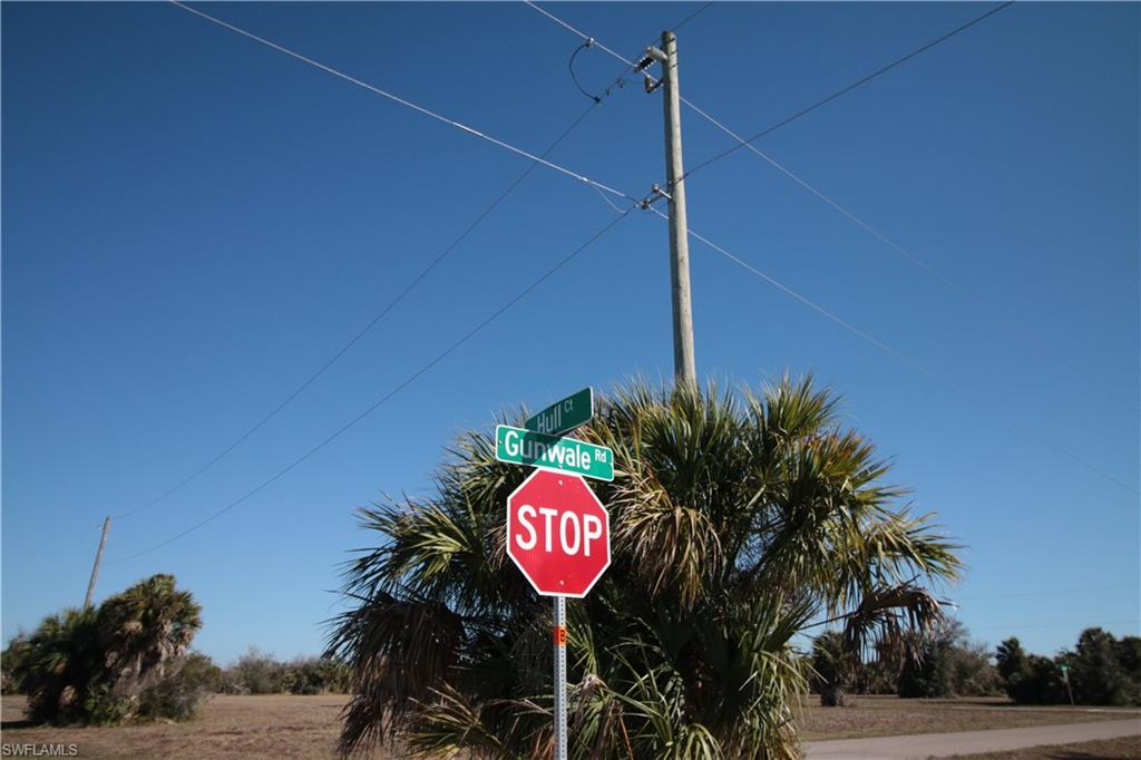 1 Hull Court Placida, FL 33946 - Photo 2 of 13 a street sign on a wall next to a road