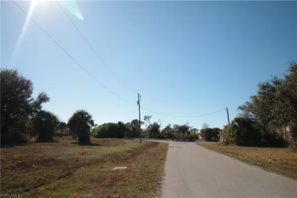 a view of a road with a building in the background