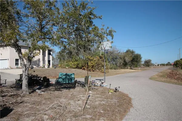 a view of a street with some trees