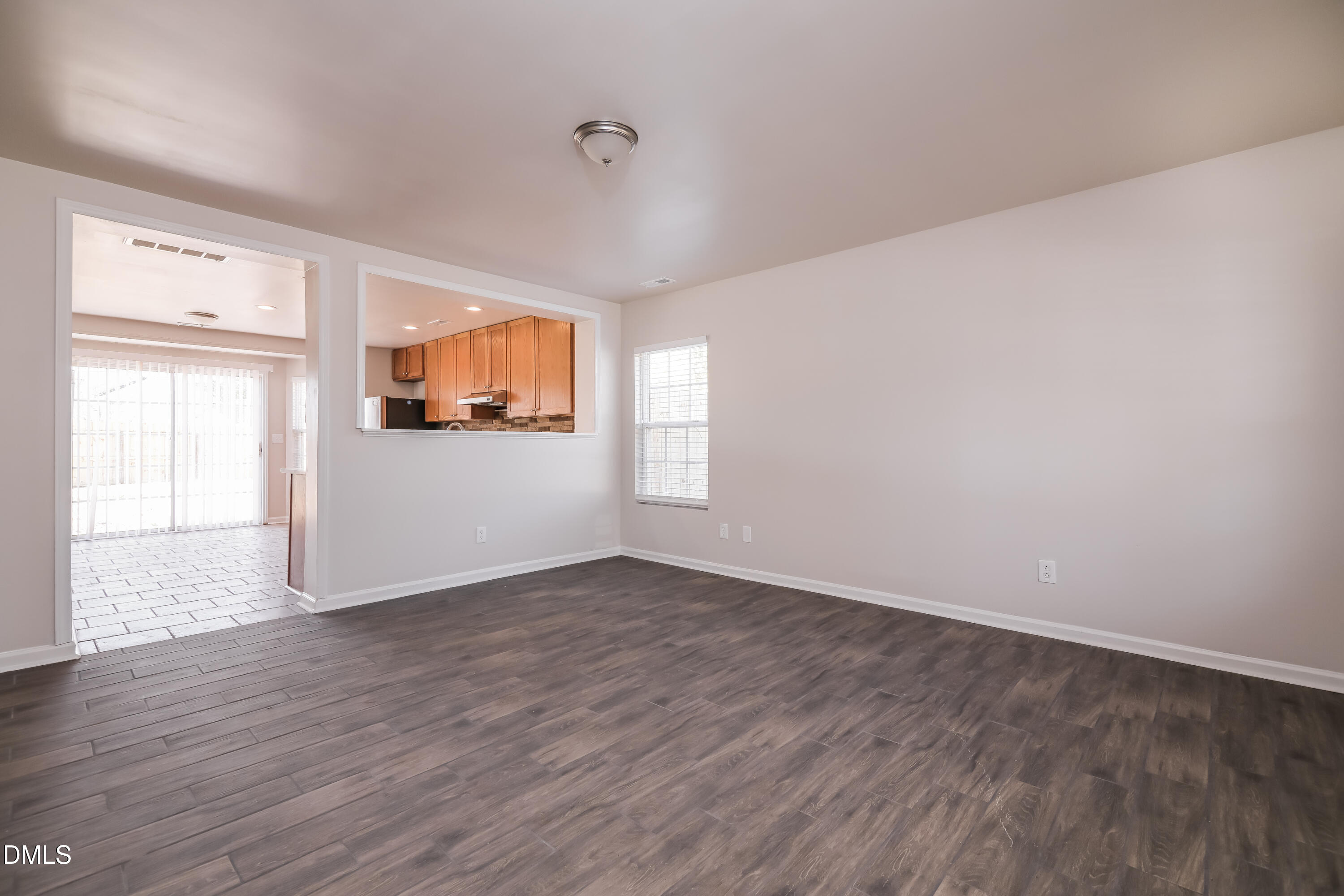 3716 Tryon Ridge Drive Raleigh, NC 27610 - Photo 2 of 17 an empty room with wooden floor and windows