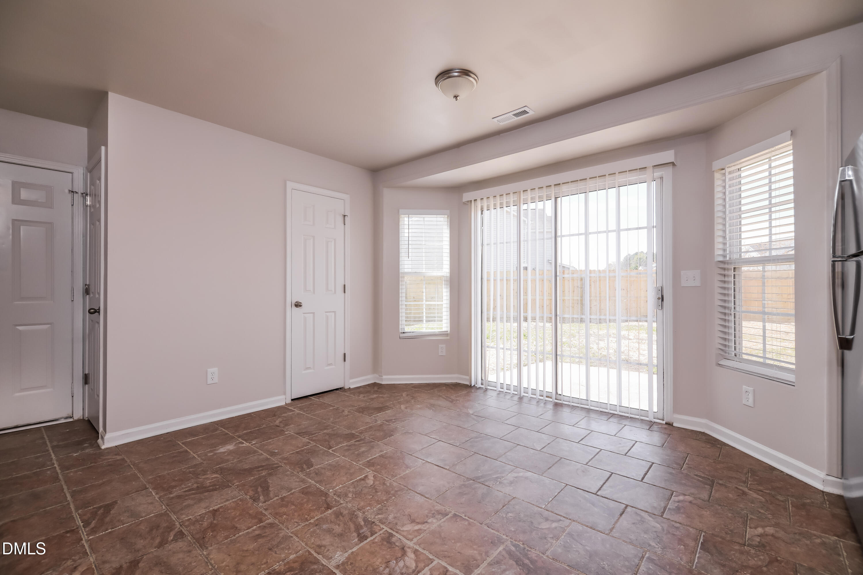 3716 Tryon Ridge Drive Raleigh, NC 27610 - Photo 4 of 17 a view of an empty room with a window
