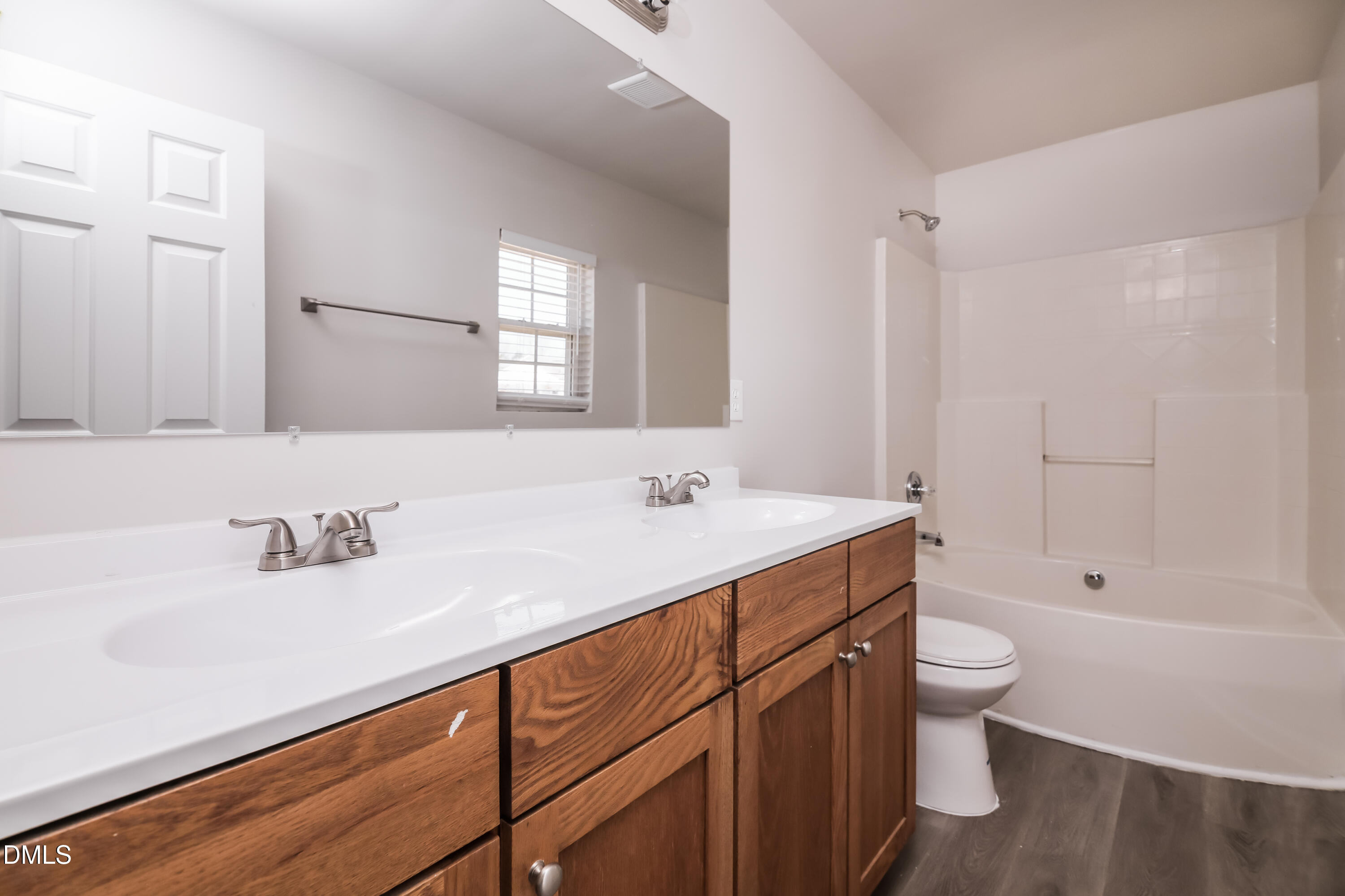 3716 Tryon Ridge Drive Raleigh, NC 27610 - Photo 9 of 17 a bathroom with a sink a toilet and shower