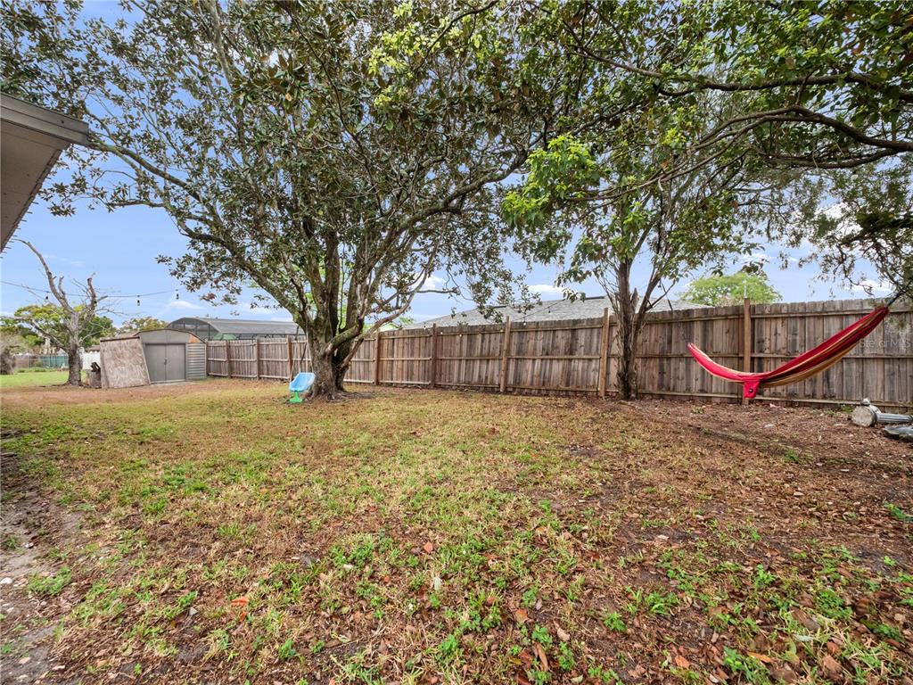 2733 Middle Street Orlando, FL 32807 - Photo 21 of 23 a backyard of a house with table and chairs